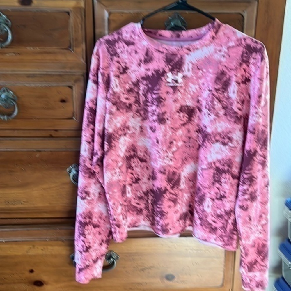 Under Armour Women’s pink and white cropped sweatshirt, size medium.